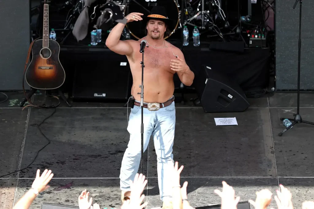 SHOCKING! Gavin Adcock Falls Shirtless Into Crowd During Concert—Cowboy Hat Lost in Chaos!