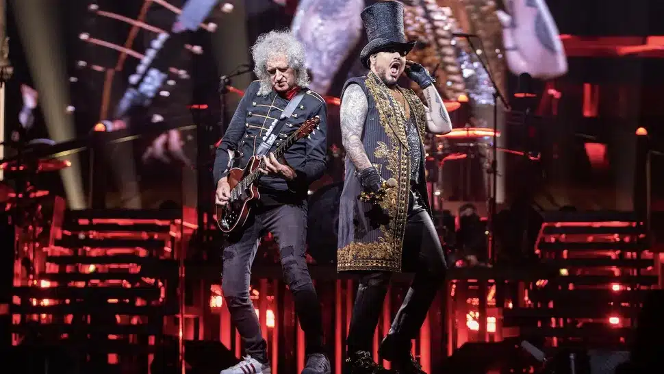 90 SECONDS. THAT’S ALL IT TOOK FOR ADAM LAMBERT TO TURN AN OPERA CLASSIC INTO A RELIGIOUS EXPERIENCE. The Air Trembled, The Lights Dimmed — And Then He Unleashed A Note So Powerful It Felt Like The Sky Itself Was Splitting Open. In A Breathtaking Surprise, Queen’s Rock Titan Took On Puccini’s “Nessun Dorma”… And Conquered It With Flames Of Pure, Operatic Passion. Brian May Could Barely Contain His Emotion, His Voice Cracking As He Whispered, “I Can See Luciano Smiling.” The Crowd Didn’t Just Cheer — They Stood Frozen, Eyes Wet, As If Witnessing A Miracle In Human Form.